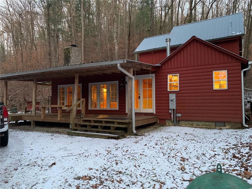 View of log cabin in snow/winter.