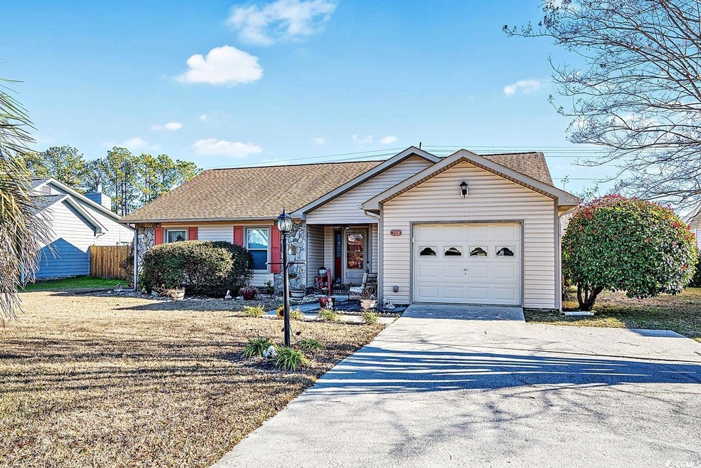 Single story home featuring a garage