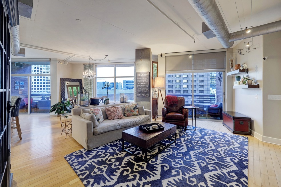 This area anchors the kitchen, dining room and bar