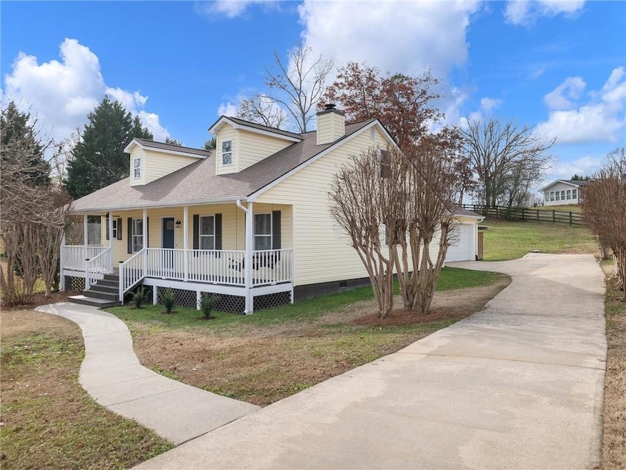 View of front of house featuring covered porch, a 