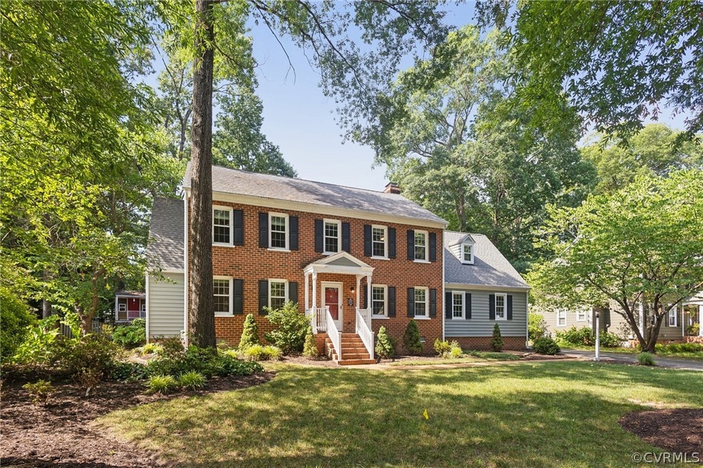 Colonial inspired home with a front lawn