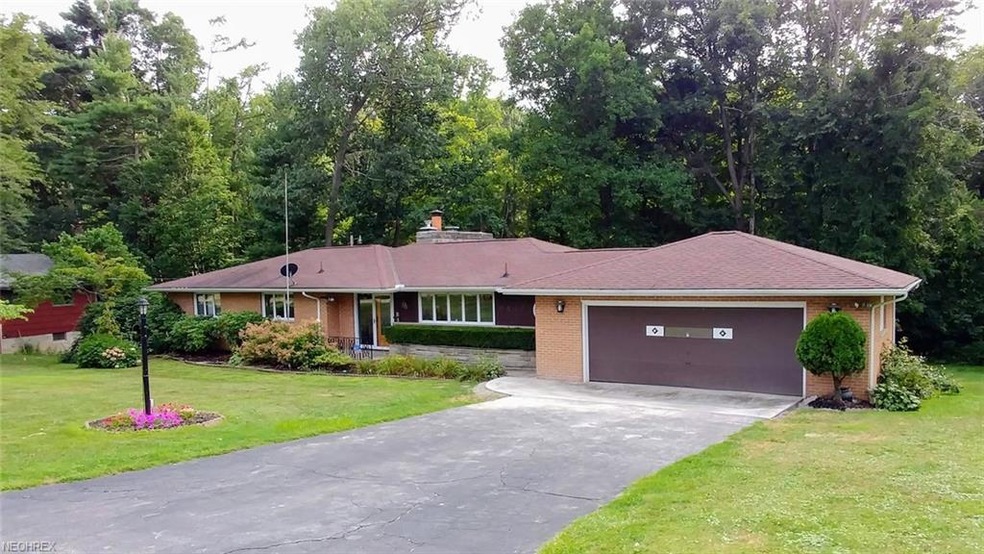 Sprawling brick ranch overlooking a wooded ravine