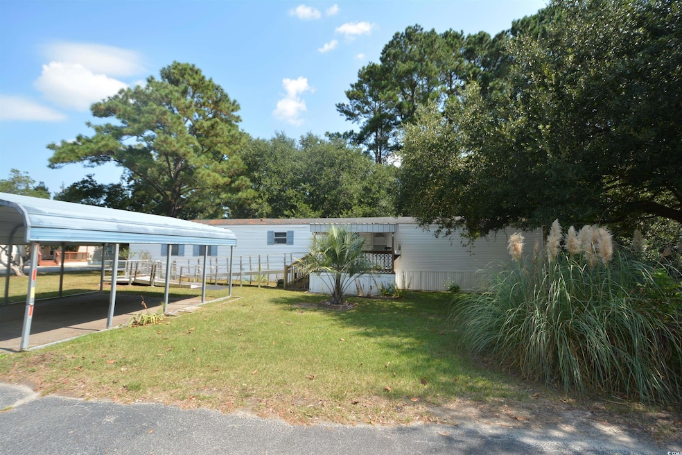 View of yard featuring a carport