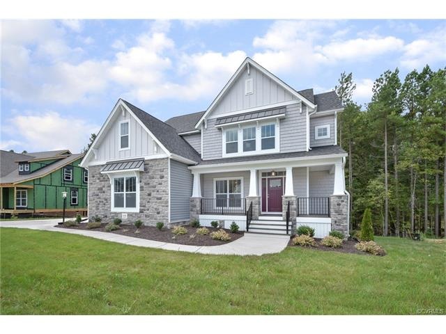 This is a great homesite, flat in the front and some great privacy in the back!  Low maintenance vinyl siding, beautiful stone and metal accent roofs!