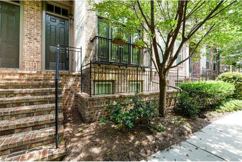 Brownstone-style townhome with limestone accents, 