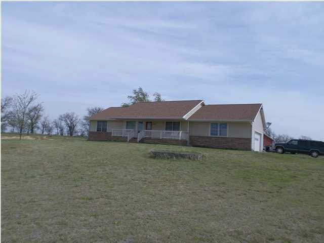 FRONT OF HOME. HOME SITS BACK FROM ROAD WITH A LON