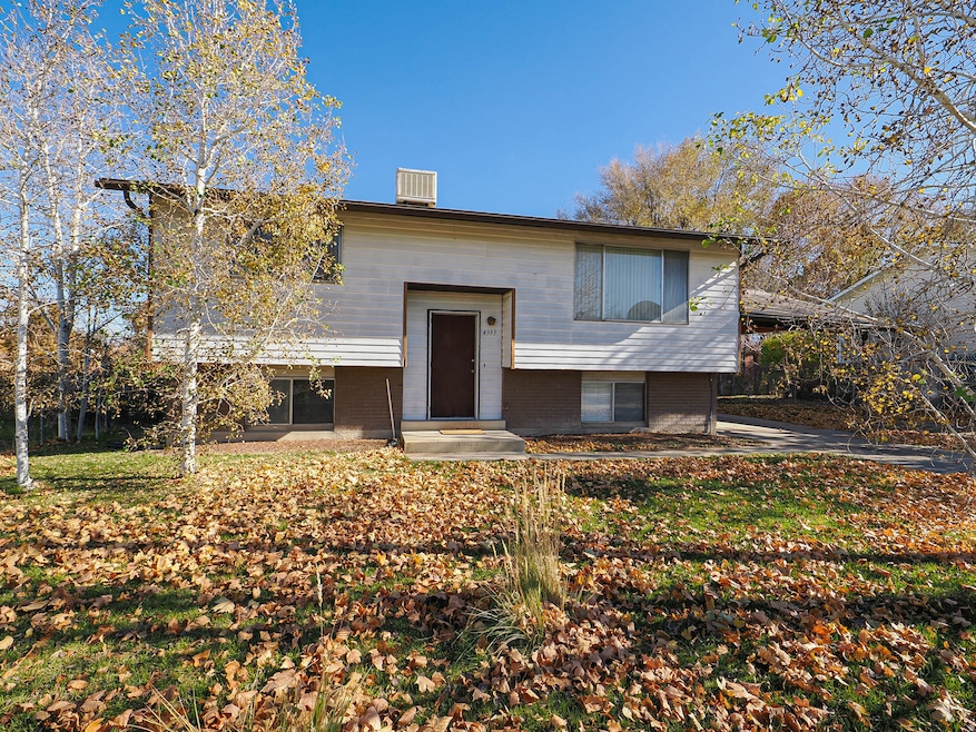 Bi-level home featuring brick siding