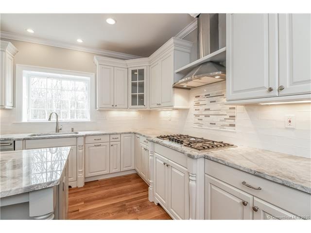 Huge, bright kitchen. Custom white self-closing ca