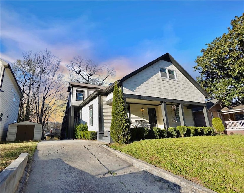View of front of home with an outbuilding, a front
