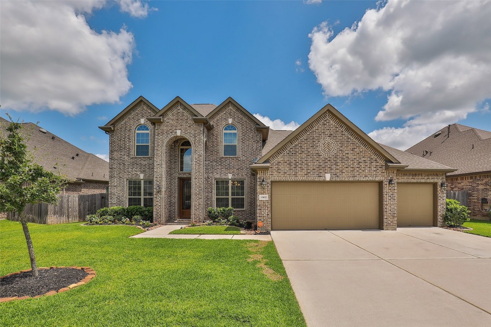 Beautiful 13102 Hazelwood Hollow Drive!  Wide driveway, 3-car garage.
