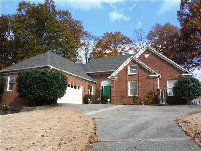 Handsome brick home with architectural shingle roo