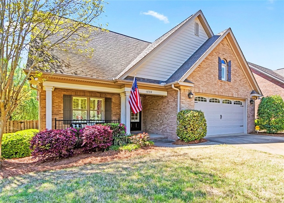 Lovely brick exterior and inviting front porch.