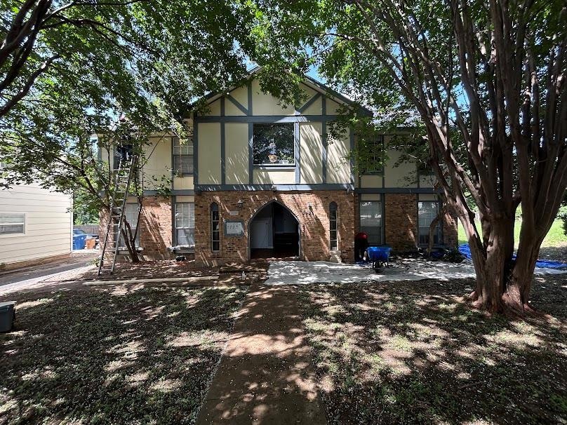English style home with brick siding