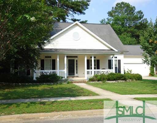 Exterior Front. This low country home offers lush 