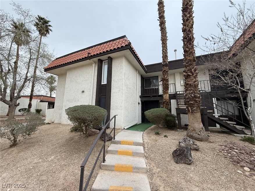 View of front of property featuring a tiled roof,