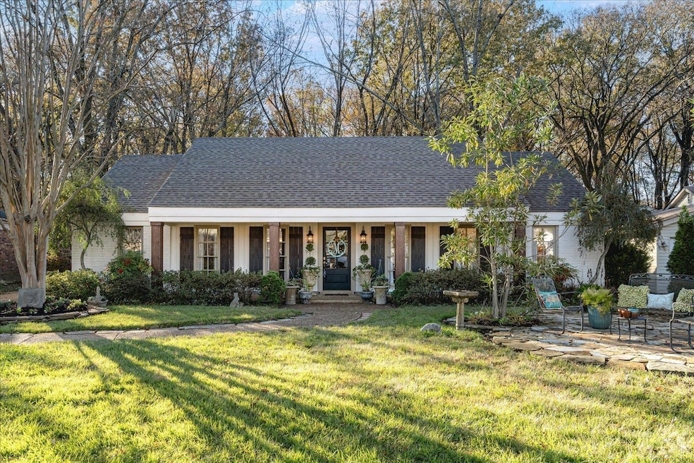 View of front of property with covered porch and a