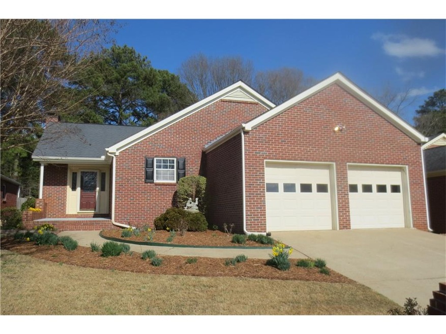 Charming four sides brick cluster home.