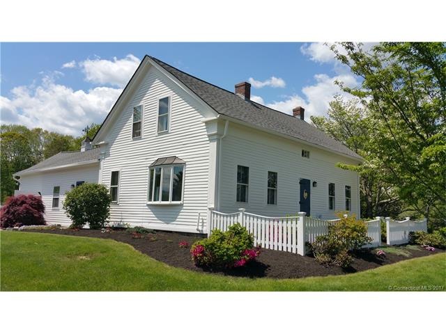 Professionally landscaped New England cape.