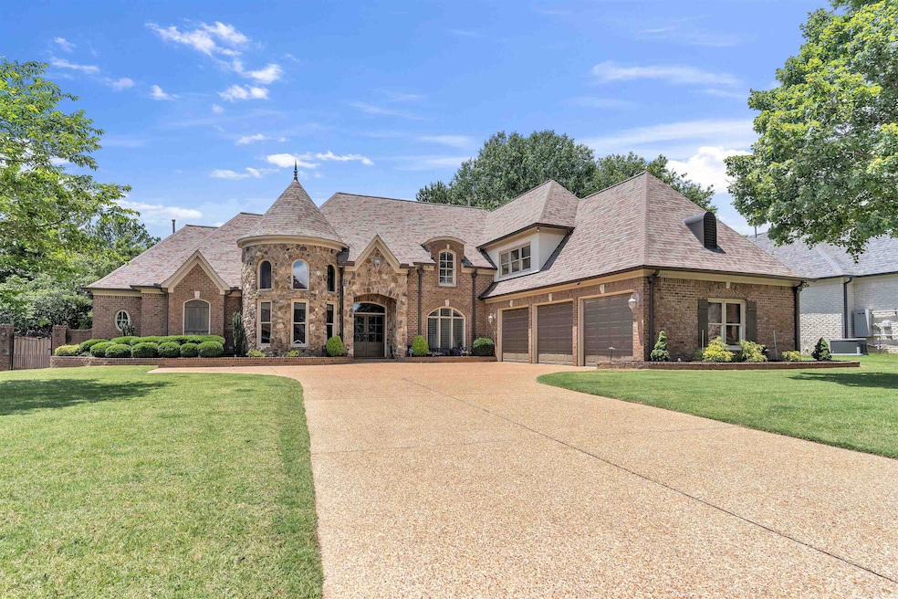 Gorgeous French country style house featuring brick siding, and a shingled roof new in 2024! Huge 3 car garage.
