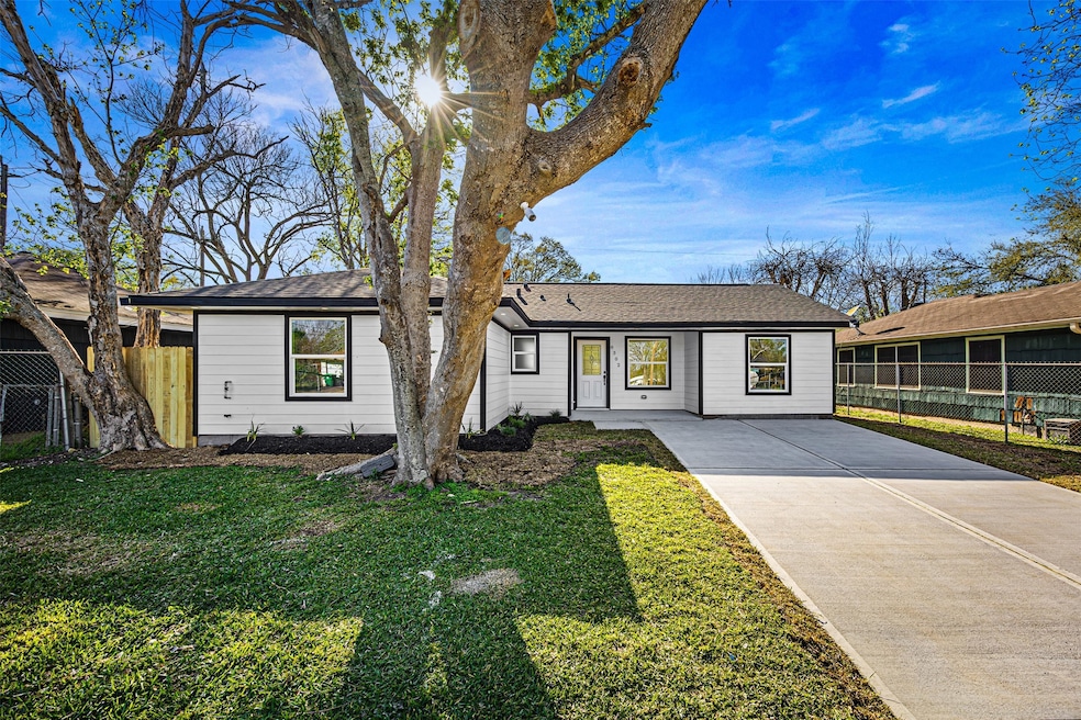 Front view of home with new driveway