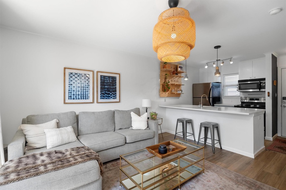 Living area featuring wood finished floors, baseb