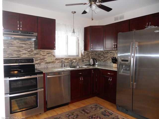 Exterior Front. Updated Kitchen with granite count