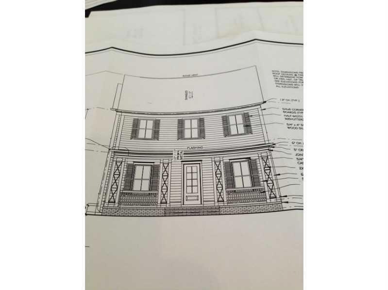 Exterior Front. Front elevation with full porch