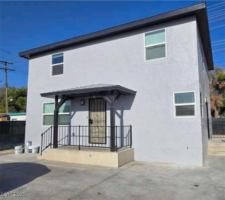Front view of 2 story apartment complex with stucc