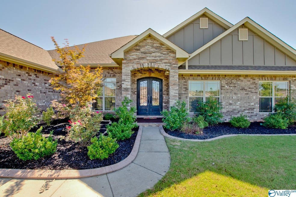 Featuring 4 beds on main level, a sunroom, huge op