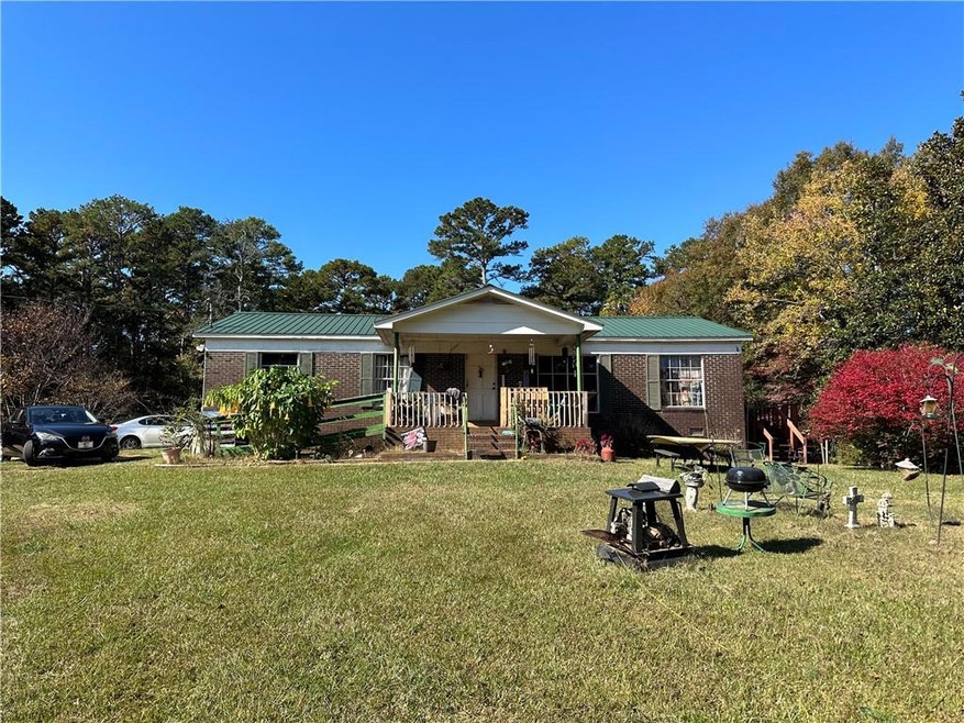 View of front of home featuring a porch and a fron