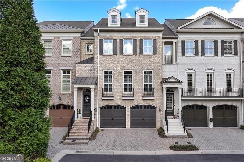 Multi unit property featuring a balcony and a gara