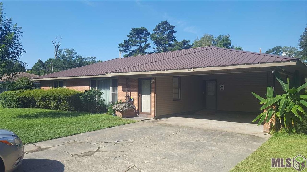 Metal Roof, brick and vinyl siding.