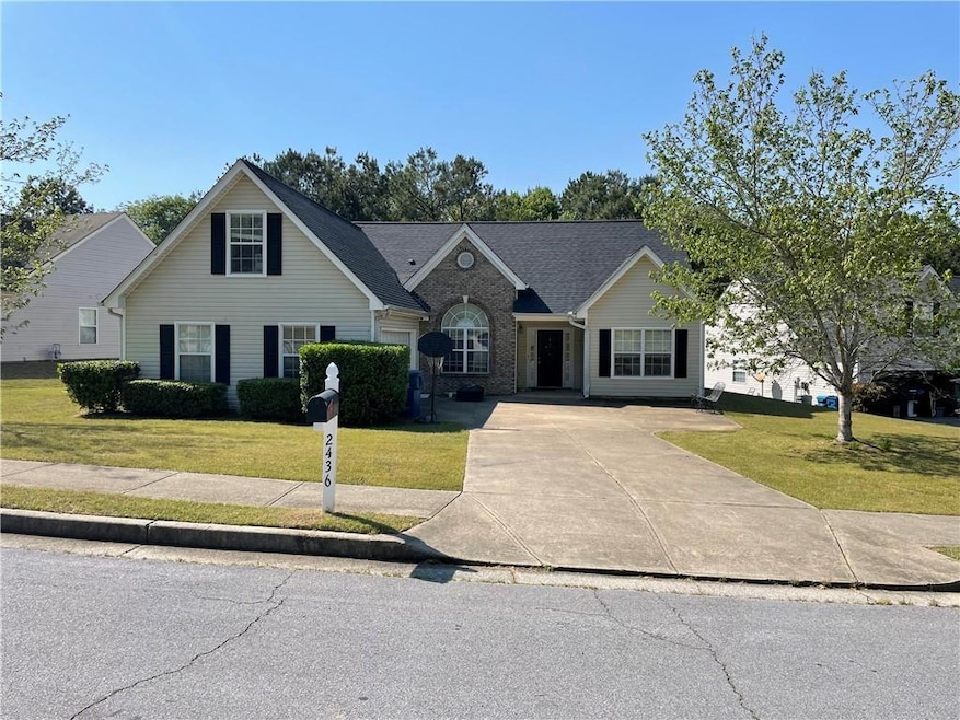 Traditional home featuring a long concrete driveway capable of parking 6-7 vehicles, plus a 2 car garage.