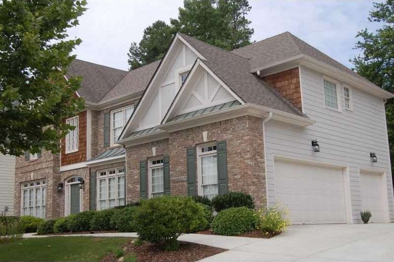 Exterior Front. Brick Front with Hardiplank siding
