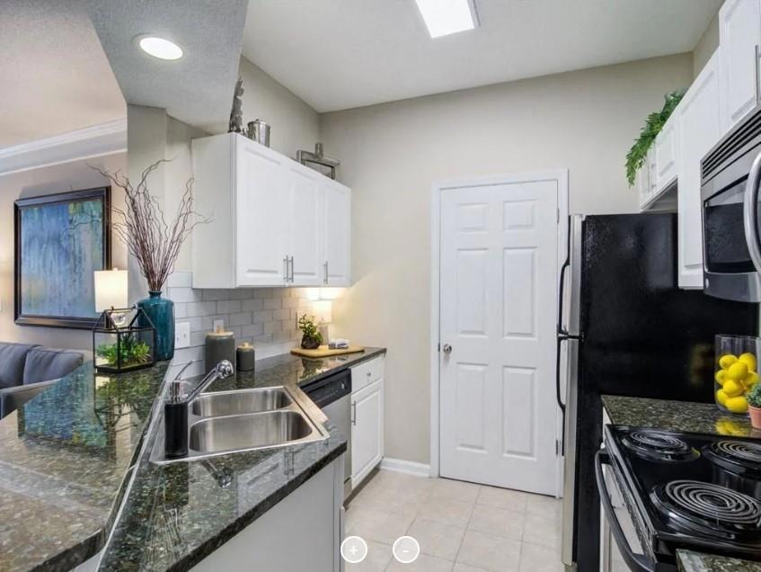 Kitchen with sink, appliances with stainless steel