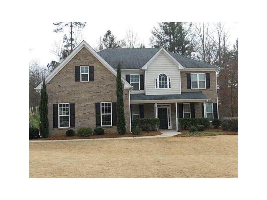 Exterior Front. Brick front with concrete siding