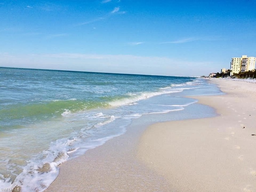 Property view of water with a beach view