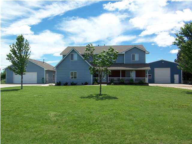 Beautiful Home with covered porch, in a nice count