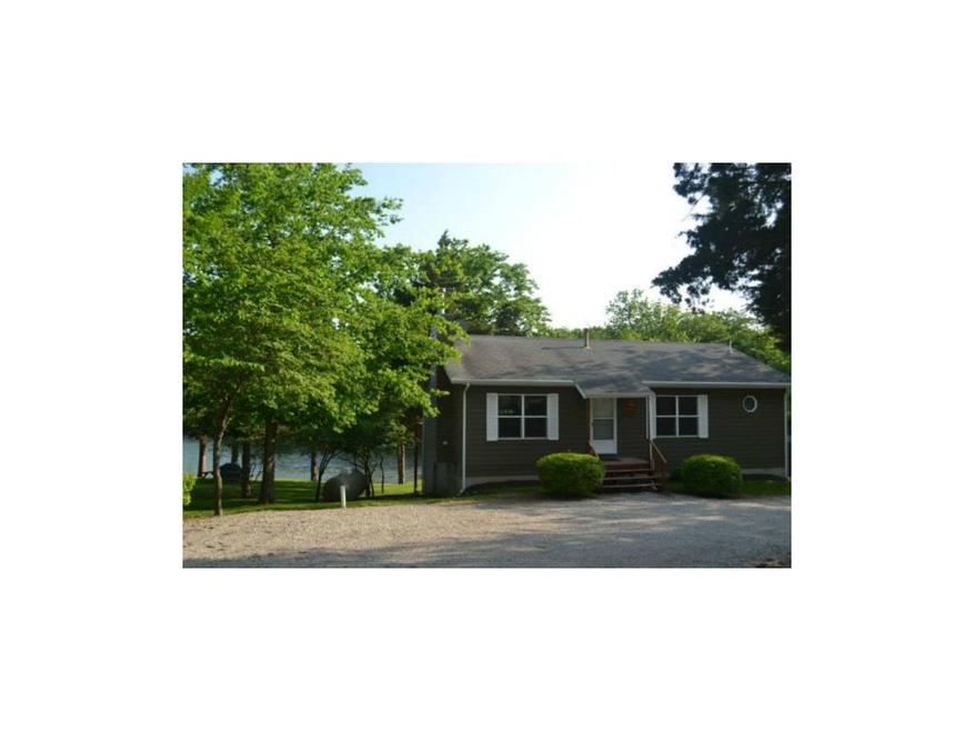 View of home entering driveway