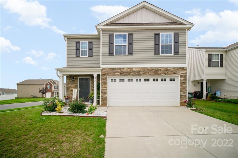 Welcom Home! Exterior details include stone accent, shutters and front porch.