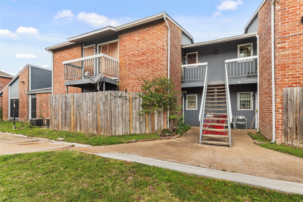 Step up to this charming second-floor condo on the