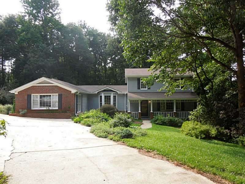 Facade/Exterior Front. Front View - nestled in the