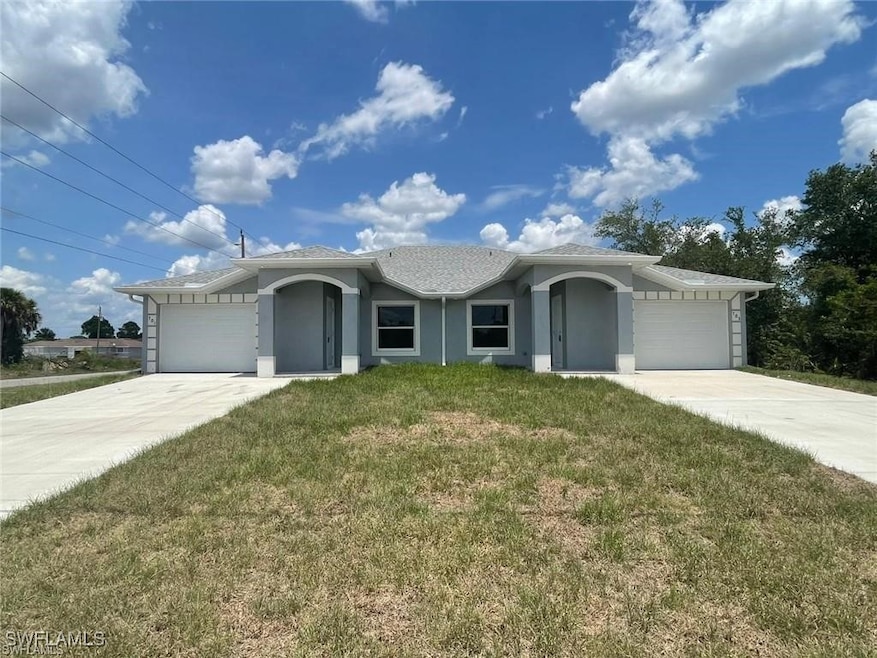 Single story home featuring a front lawn, stucco s
