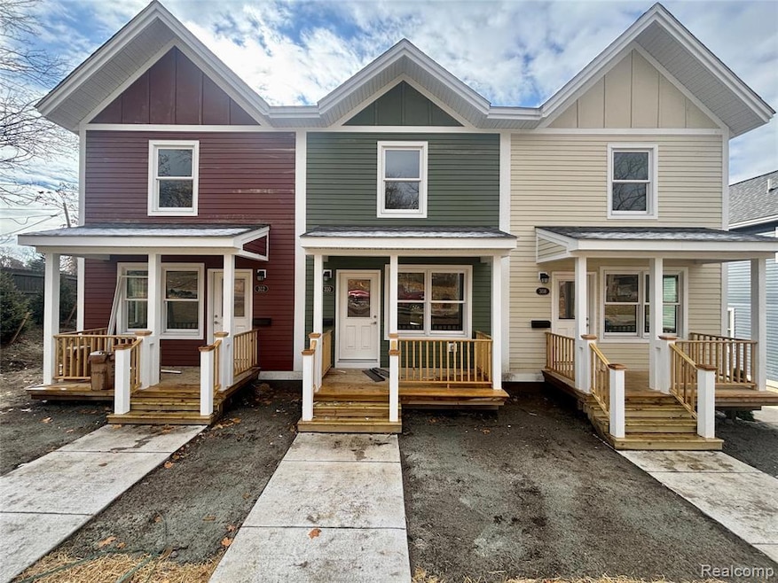View of front of property with a porch and board and batten siding