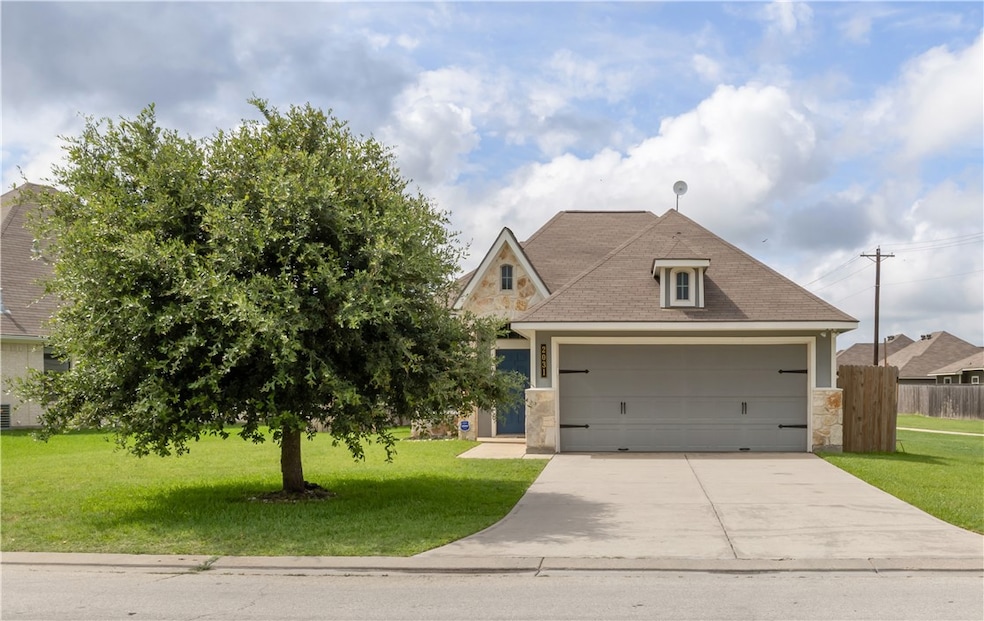 View of front of property with stone siding, concr