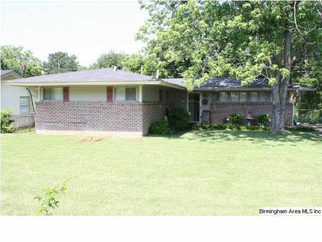 Cute home with lots of windows . Large level back 