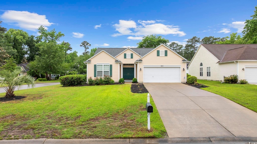 Traditional-style home with driveway, a front lawn