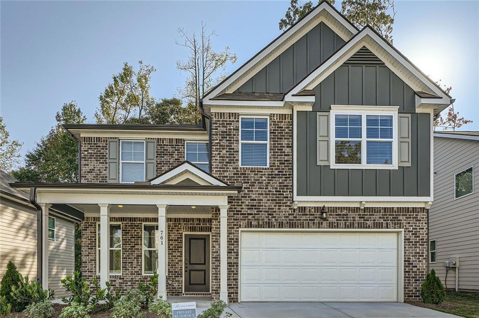 View of front facade featuring a garage