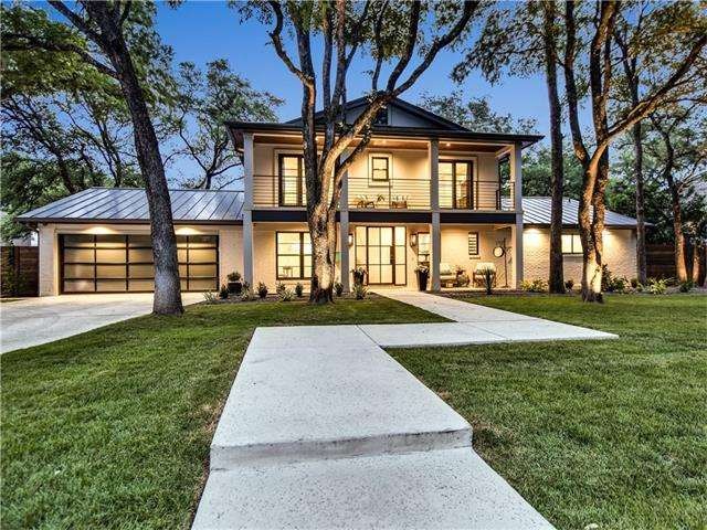 Wide path welcomes guest to this magnificent home