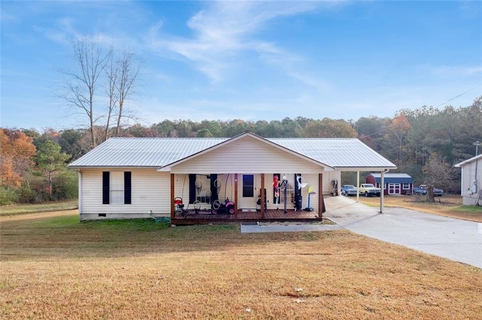 Ranch-style home with a front lawn and a porch